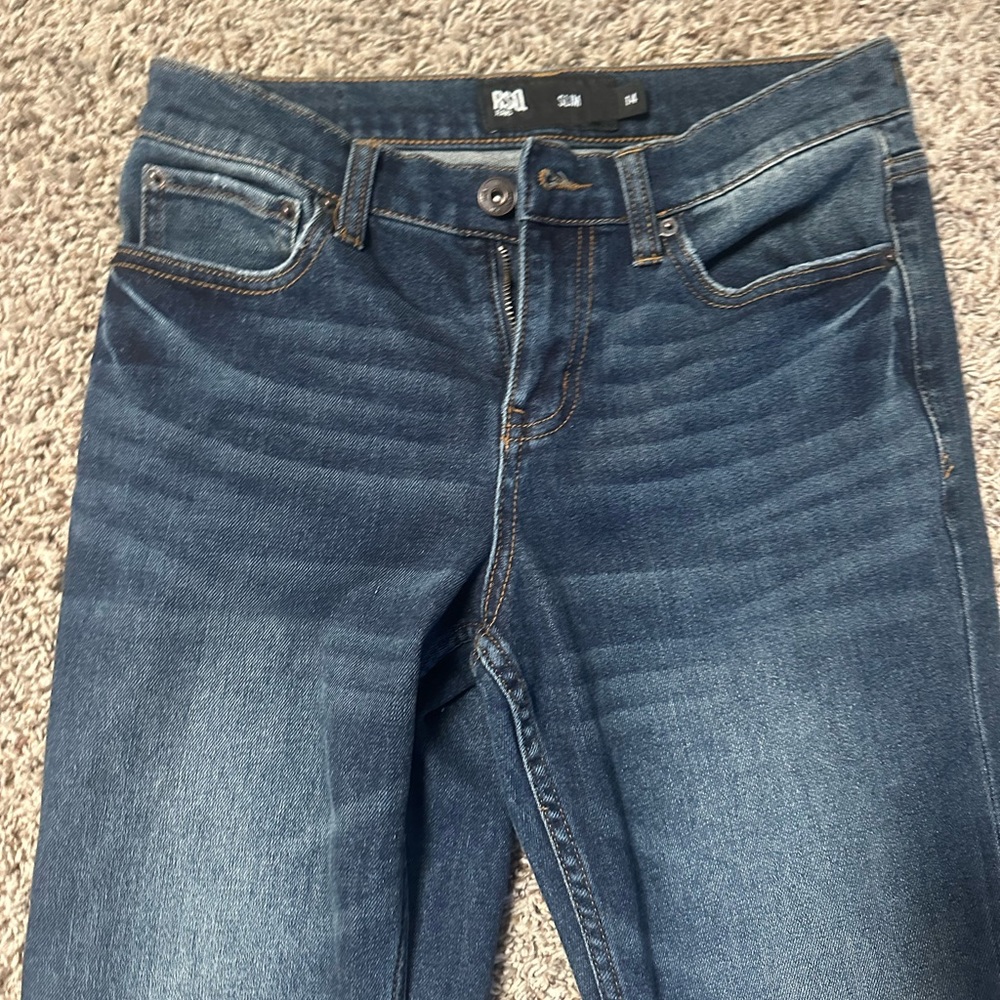 Navy blue mid-rise slim fit jeans size 14. fits more baggy. RSO jeans